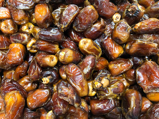 Dates fruit in the market, closeup of a date fruit