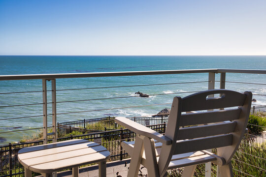 Chair and Table Overlooking the Calm and Serene Pacific Ocean Landscape