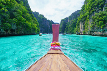Traveling with long tail boat on fantastic emerald lagoon sea at Koh Phi Phi Island Thailand, Pileh Lagoon. - 571771939