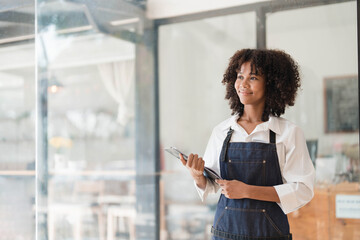 Startup successful small business owner sme beauty girl stand with tablet smartphone in coffee shop...