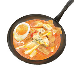 Korean spicy rice cakes in laksa sauce in a frying pan served hot