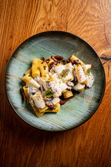 pasta with meat on the wooden background