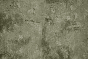 Old concrete wall texture. Light pale olive green color. Rough dirty texture background. Close-up. ...
