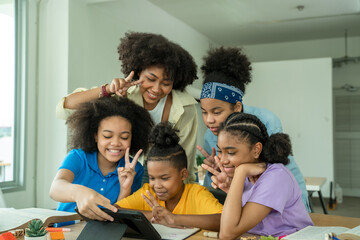 Elementary school children using digital tablet in classroom,Education,Wireless technology and school concept.