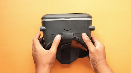  young man holding a virtual reality headset, vr box.