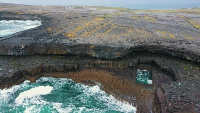 Orbital shot R to L of the "Wormhole" natural rock formation on the island of Inis M&oacute;r off the West Coast of Ireland. The Wormhole of often used for swimming and great instagram pictures by tourists.