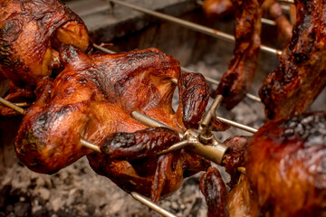Lechon manok, a Filipino spit-roasted chicken dish. As seen being cooked in an oven at a roadside...