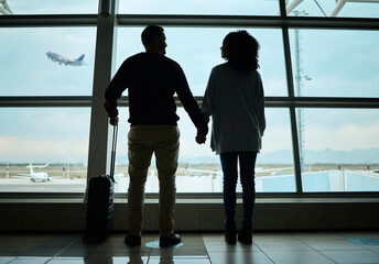 Silhouette, travel and holding hands with couple in airport for departure, flight and vacation...