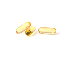 Primrose oil capsules on white background.