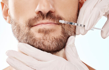 Man, lip filler injection and mesotherapy with face, hands and needle syringe and beauty on blue background. Dermatology, cosmetic care and procedure, health and skincare with wellness and collagen