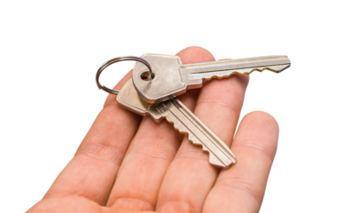 Real estate concept. Two keys on a palm. png transparent