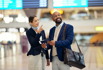 Businessman, airport and passenger assistant pointing traveler to departure, flight time or information. Black male with service agent helping in travel, directions or FAQ for airline traveling - obrazy, fototapety, plakaty