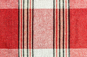 On the red fabric, vertical and horizontal strips of different widths