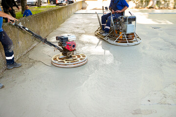 Two types of power trowel with engine, machine for finishing, leveling concrete surface