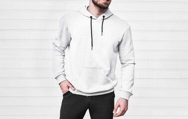 Copy space hoodie design for branding clothes. young bearded man standing in white hoodie