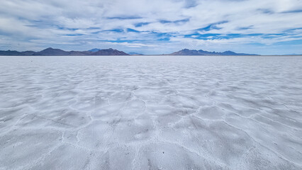 Scenic view of Bonneville Salt Flats in western Utah with Silver Island Mountains peaks in the...