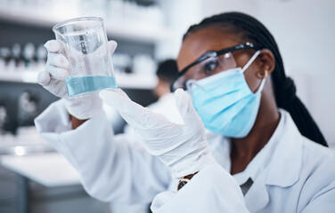 Science, covid and liquid with a black woman doctor working in a laboratory for research or innovation. Medical, analytics and development with a female scientist at work in a lab for chemistry