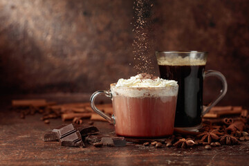 Hot chocolate with whipped cream and black coffee.