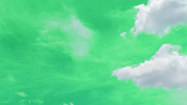 The green screen of moving white clouds with 4K resolution. Can use to change the background color.	
