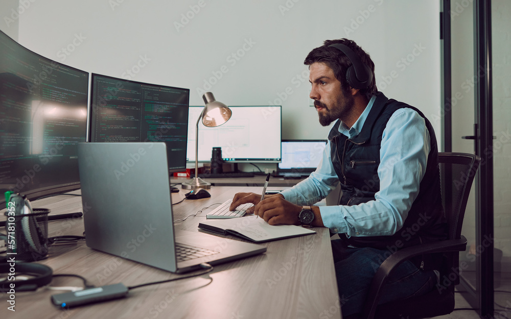 Aufkleber Headphones, programmer and man on computer with book, coding or programming while writing notes at night. Information technology, notebook and male working on software while streaming music or radio.