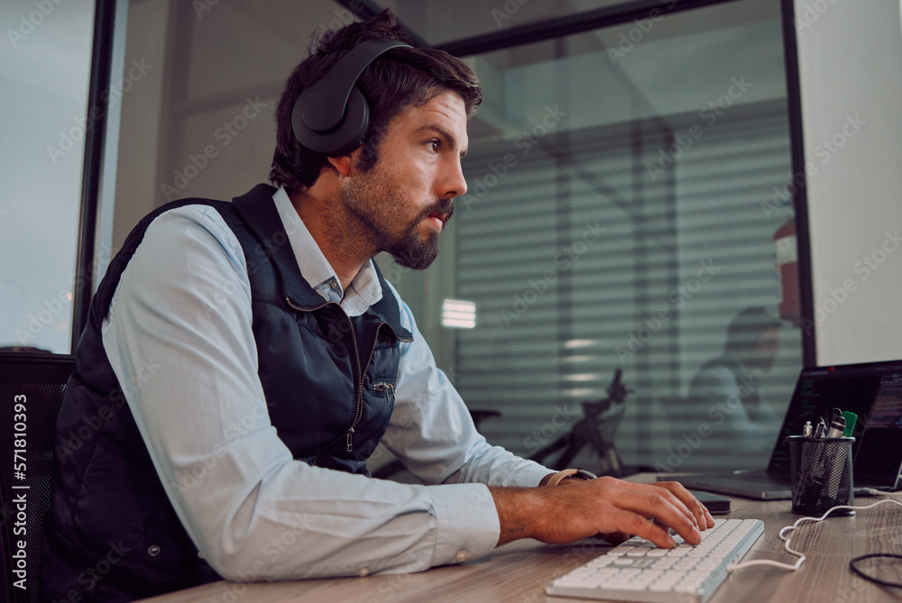 Aufkleber Headphones, programmer keyboard and man typing, coding or programming online at night. Information technology, computer and male employee or coder working on software while streaming music or radio.