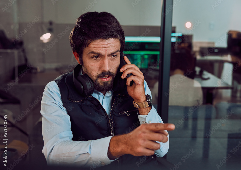 Leinwandbilder Programmer, phone call and man talking in office, chatting and speaking to contact at night. Information technology, pointing and thinking male employee or coder with mobile smartphone for networking