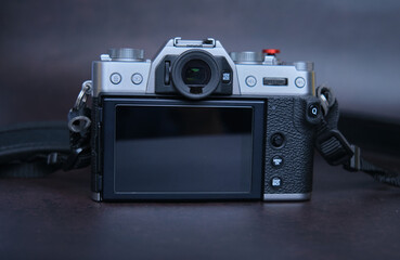 back view of Control buttons mirror less digital camera close-up on dark background