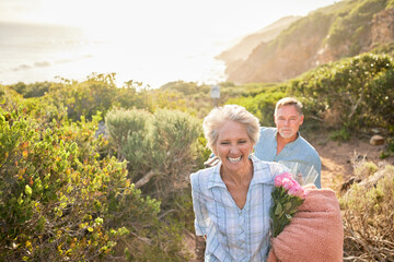 Hiking, mockup and a senior couple on a valentines day picnic together in the mountains for...