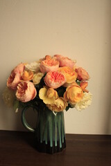 flower vase of colorful yellow romantic roses