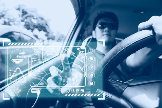 male car driver using GPS navigator system on hologram touch panel modern technology for transportation assistant