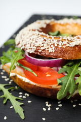 Concept of delicious food - tasty bagel sandwich