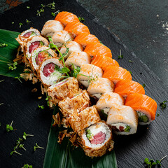 tasty sushi on the wooden background