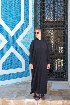 Tourist wearing a black niqab in front of a mosque, Amman, Jordan