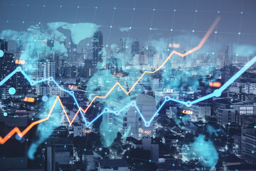 Fototapeta premium Creative glowing business chart and map on blurry city backdrop. Stock, global finance growth and financial graph concept. Double exposure.