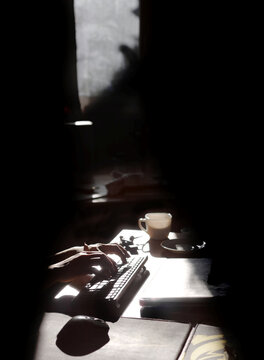 The hand of writer in the dark mood