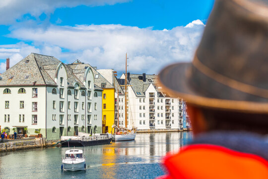 Rear view of man admiring the Art Nouveau buildings, Alesund, Norway