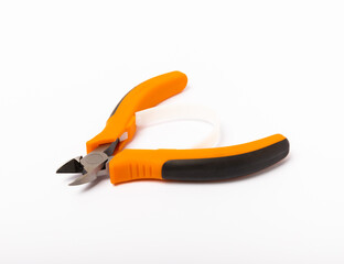 Obraz premium Wire cutters with orange handles isolated on white background
