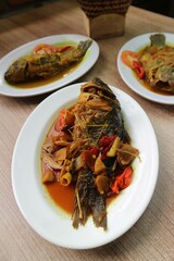 fried fish dish with spices sauce