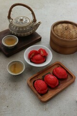 sweet steamed cake with green bean filling served with green tea