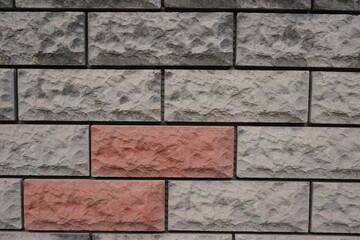 wall made of gray and orange stones