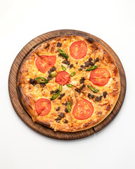 Pizza slice with tomatoes, cheese and minced meat. Pizza is cut into slices on wooden board. Italian Cuisine. Fast food. Isolate on white background. Close-up. Top view. Copy space. 