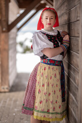 Young beautiful slovak woman in traditional dress. Slovak folklore