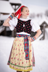 Young beautiful slovak woman in traditional dress. Slovak folklore