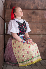 Young beautiful slovak woman in traditional dress. Slovak folklore