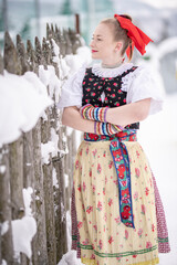 Young beautiful slovak woman in traditional dress. Slovak folklore