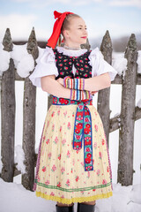 Young beautiful slovak woman in traditional dress. Slovak folklore