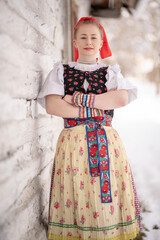 Young beautiful slovak woman in traditional dress. Slovak folklore