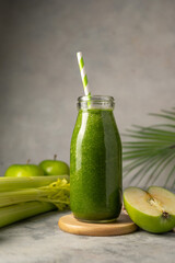 Bottle of green apple and banana smoothie, detox smoothie shake drink