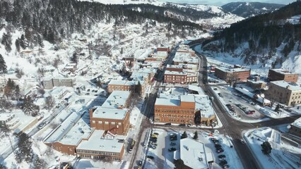 Flying over Main Street in Deadwood, South Dakota during winter