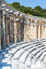Aspendos, Antalya region, Turkey (Turkiye). The columned gallery above the auditorium-theatre in the Ancient Roman Theater of Aspendos. Vertical shot